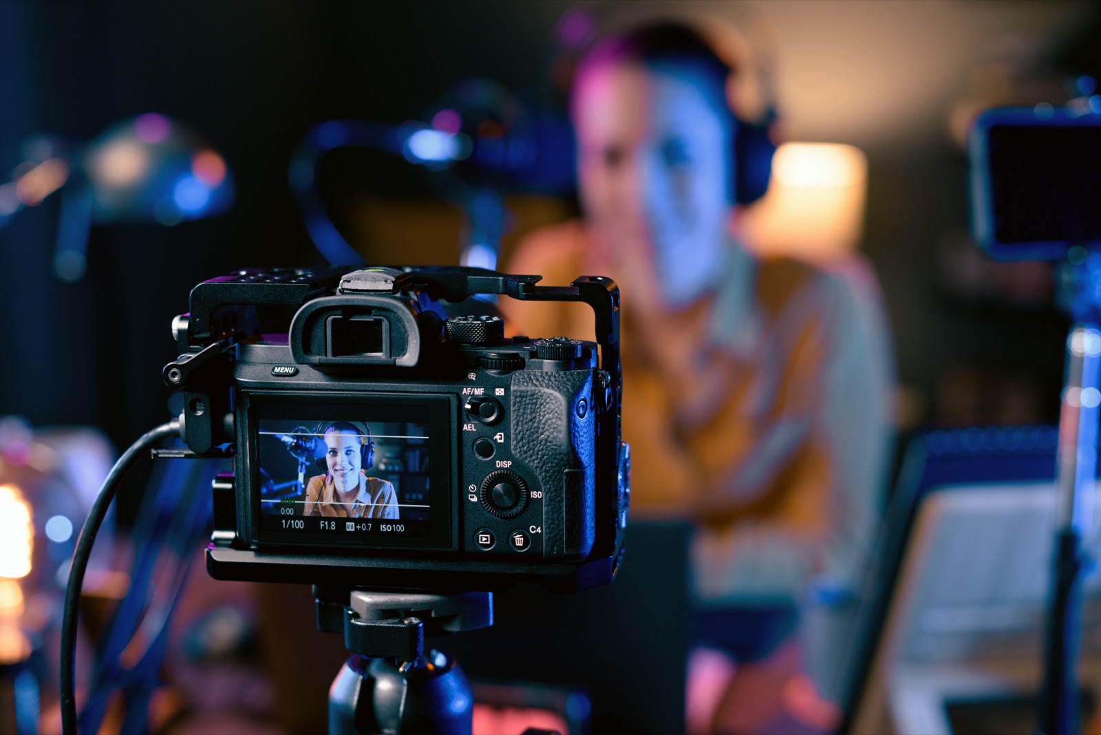 Indie filmmaker behind a cinema camera capturing a creative interview